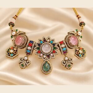 Navratna rose stone choker with sunburst centre, pink ovals and hexagon drops on ivory satin