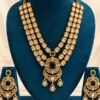 opulence-design13-1-600x900 Three-row kundan rani haar and chandbali earrings on a teal velvet stand
