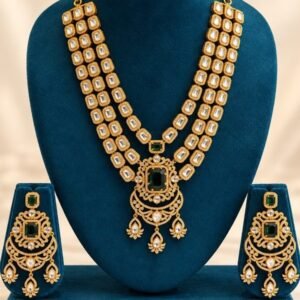 Emerald-green kundan rani haar with chandbali-style pendant and matching earrings