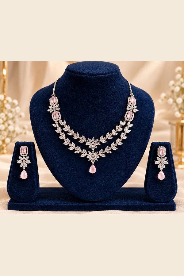 opulence-design14-1-600x900 Blush pink AD necklace and earrings on a navy stand, wider view
