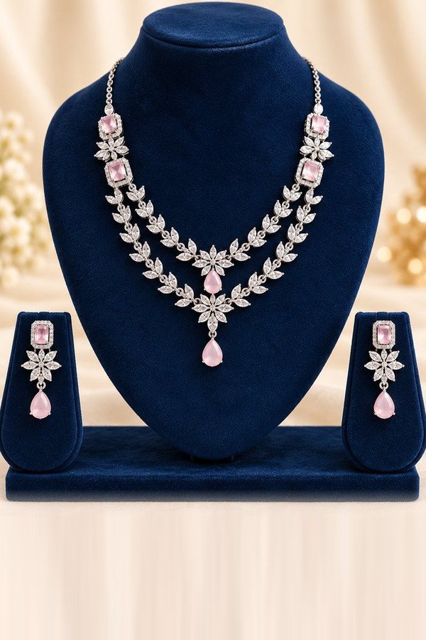 opulence-design14-main-600x900 Blush pink American diamond two-layer necklace and matching drop earrings on a navy velvet stand
