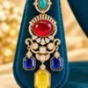 opulence-design2-2-600x900 Close-up of one earring with turquoise-coloured top, red oval and blue and yellow drops