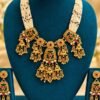 opulence-design3-1-600x900 Green meenakari multi-strand necklace set with matching earrings on a teal stand