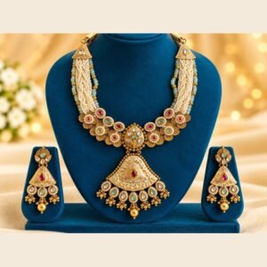 opulence-design5-1-600x900 Ivory meena necklace with pearl-look and mint bead strands and matching earrings on a teal stand