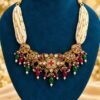 opulence-design6-main-600x900 Pearl-look multi-strand choker with antique-finish centrepiece and ruby- and emerald-toned bead drops