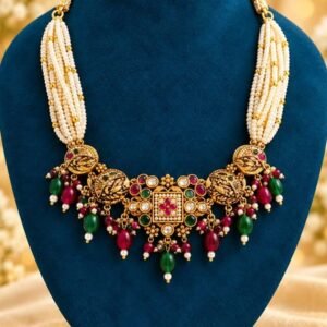 Pearl-look multi-strand choker with antique-finish centrepiece and ruby- and emerald-toned bead drops