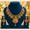 opulence-design7-1-600x900 Antique floral medallion necklace with green bead strands and matching earrings on a navy stand