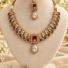 Kundan-style necklace with square ruby-toned centre and clear teardrop, with matching maang tikka